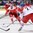 MINSK, BELARUS - MAY 17: Denmark's Mads Christensen #60 chases a bouncing puck with Czech Republic's Martin Sevc #55 and Jakub Kindl #2 during preliminary round action at the 2014 IIHF Ice Hockey World Championship. (Photo by Richard Wolowicz/HHOF-IIHF Images)

